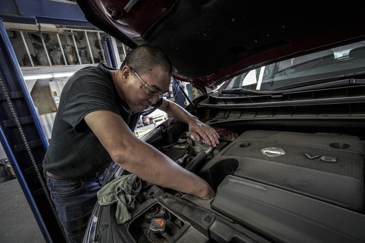 Automotive workshop with vehicle on lift