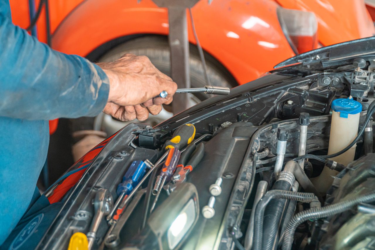 Vehicle on hydraulic lift for servicing
